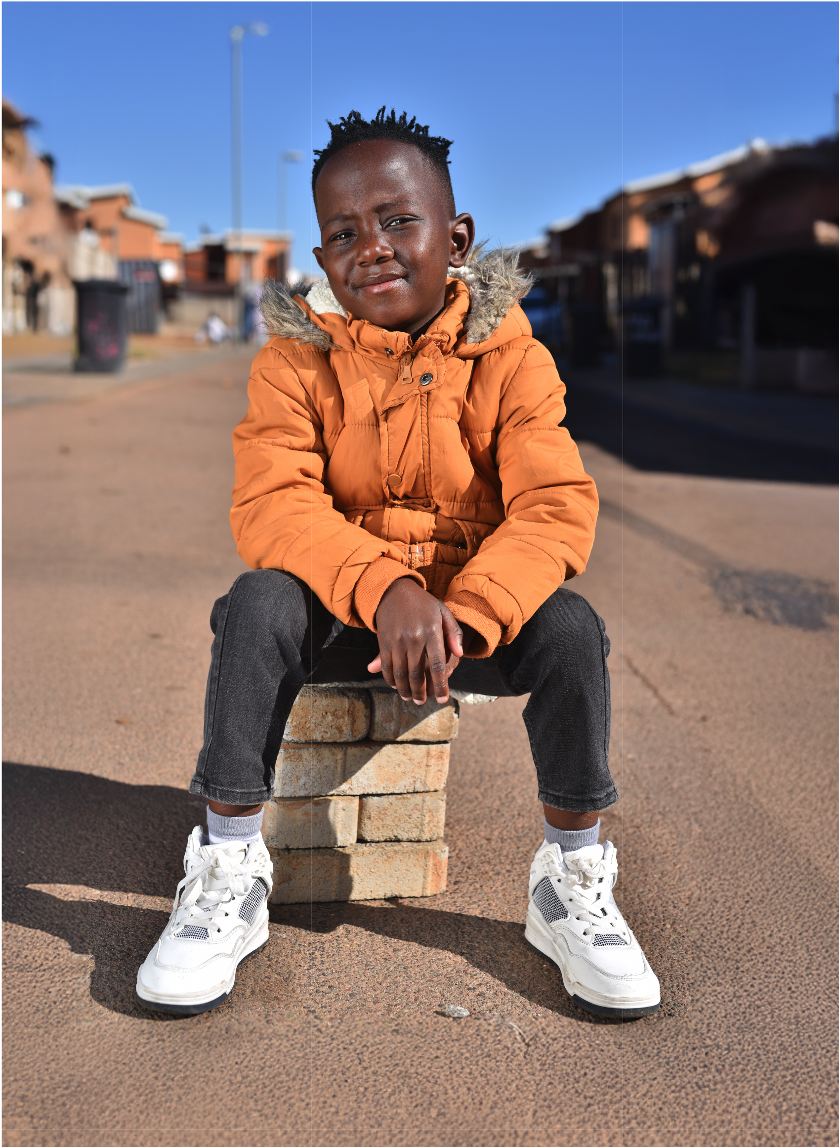 Child sitting outdoors